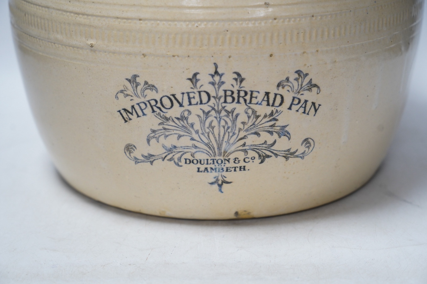 A Doulton Lambeth improved bread pan, 23cm high. Condition - fair